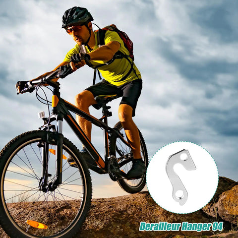 Cyclist on mountain trail with close-up of Aluminum Alloy Rear Derailleur Hanger 94 for Mountain Bikes Durable Tail Hook