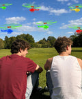 Two people in a park watching colorful helicopters flying, part of the Colorful Helicopters And Airplanes Set With Launcher, 20 Flying Toys.