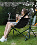 Woman relaxing in Big Ol Oversized Hammock Camping Chair For Outdoors Ultra Comfort Up To 400 Lbs with Adjustable Backrest in garden
