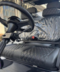 Interior view of Rugged Four Seater Electric Golf Cart With Powerful Ac Motor featuring stylish seating and steering wheel.