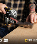 Man using Ken Onion Edition Knife And Tool Sharpening System Mk2 with adjustable angles to sharpen a tool on benchtop.