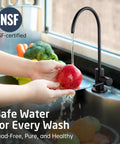 Knockout Matte Black Reverse Osmosis Kitchen Faucet, NSF Certified Lead Free Drinking Water Tap For Straight RO Hookup pouring water over an apple.