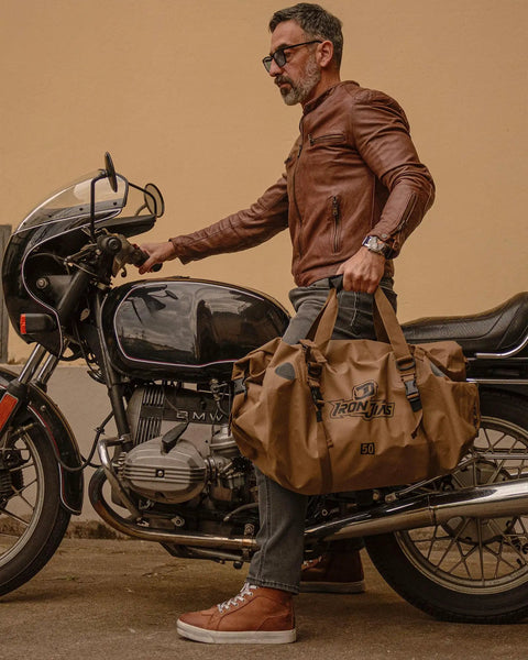 Man holding Waterproof Motorcycle Dry Bag 30L Duffle Tail Bag N Saddle Bags With Roll Top Closure by motorcycle