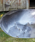 Applying Nonstick Dry Film Lubricant Aerosol 14 Oz Ultra Thin Dirt Resistant Coating to a metal shovel blade for protection