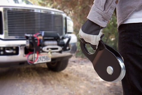 Snatch Block 15,000 Lb Capacity For Heavy Duty Winch Pulls, Doubles Your Pull Power, Great For Angled Pulls in hand near truck