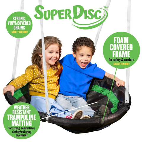Two children sitting on a foam padding disc swing for two, part of the backyard swing set with multiple play stations for up to five kids.