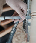 Close-up of Dead On Precision Cryo Treated M2 High Speed Steel Bead Forming Chisel For Wood Lathe in hand shaping wood.