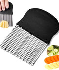 Stainless steel crinkle cutter with black non-slip handle; large wavy blade for vegetables, with cucumber and carrot.