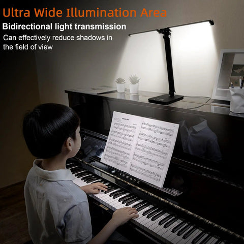 A person playing piano illuminated by a Led Desk Lamp For Home Office With USB Charging Port, Rotatable Aluminum Piano Lamp For Upright Piano, Eye Caring Reading Light In Glossy Black, Desk Setup On Point With Three Dimmable Modes And Easy Brightness Control.