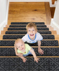 Two children on stairs with Non Slip Carpet Stair Treads Set Of 15 With Reusable Non Slip Backing For Safe Steps 8 By 30 Inches