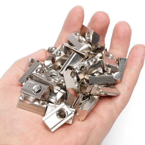 Hand holding M8 Thread T Slot Nut With Ball Spring Roll In for European Standard 40 Series Aluminum Extrusion, 50 Pack