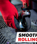 Close-up of gloved hand adjusting wheel on 2 In 1 Modular Detailing Creeper Seat With Cushion And Tool Tray, focus on smooth rolling.