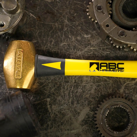 Non-Sparking 16-Inch Brass Hammer With Fiberglass Handle 5-Lb Double-Faced USA Made Non-Marring Mallet on industrial surface