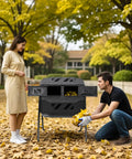 43 Gallon Outdoor Dual Chamber Tumbling Compost Bin with Two Sliding Doors placed in a garden surrounded by autumn leaves