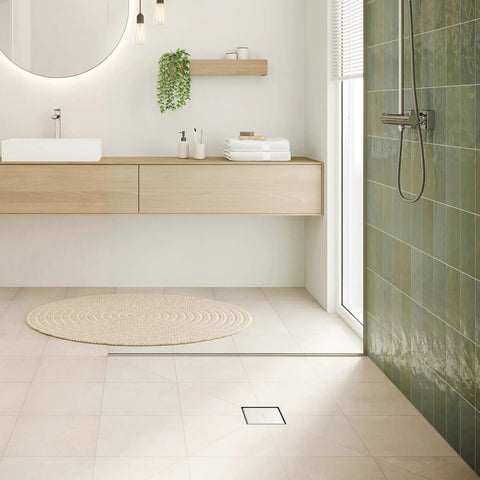 Square Tileable Shower Drain Set With Brushed Stainless Steel Construction And Flush Floor Mount Design For Modern Bathrooms featuring clean, modern bathroom with tiled shower and minimalist decor.