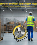 Worker moving 36 Inch Beefy Airflow High Velocity Industrial Drum Fan With 3 Speed Settings 21,800 CFM in warehouse