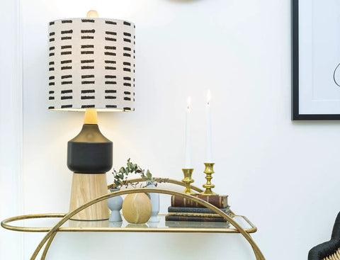 Natural Wood And Black Ceramic Table Lamp With Linen Mudcloth Shade, Rotary Switch, 60W Max on entryway console