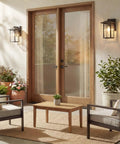 Capanna 1-Light Outdoor Wall Light In Olde Bronze With Clear Water Glass mounted beside patio doors, 13.25 In H by 8.5 In W
