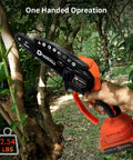 Compact 6 In Cordless Chainsaw Packs Serious Brushless Punch For No Sweat Tree Trimming And Limb Lopping Secure Lock Handles Business Smoothly Comes Loaded With Dual 21V Batteries Plus Backup Chains For Your Yard cutting a tree branch.