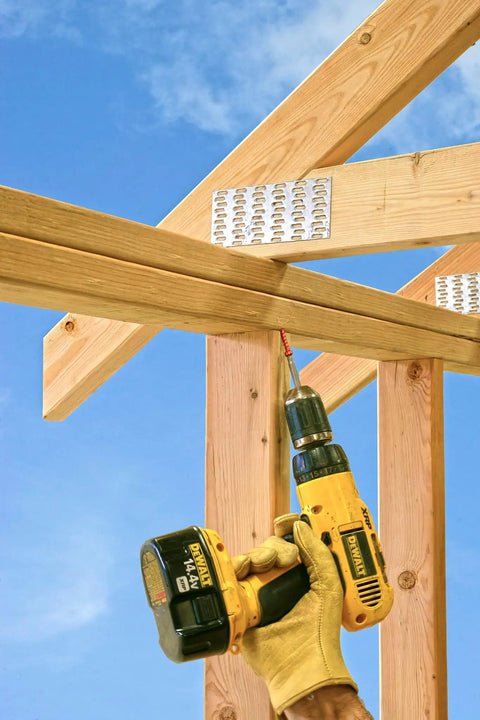 Heavy Duty Four And A Half Inch Truss Wood Screws Black Electrocoat Finish Build Tough For Interior Wall Framing and Roof Joists, drilling into timber.