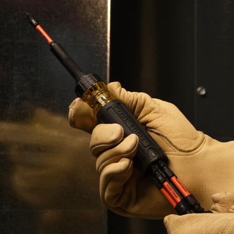 Hands holding All-In-One 13-In-1 Ratcheting Screwdriver Set For Pros And DIYers with impact-ready bits in close-up view