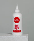 Creeping Crack Cure 8oz Sealant For Hairline Gaps And Cracks bottle on concrete surface, low-viscosity adhesive.