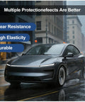Tesla Model Y Juniper 2025 2026 with Precision Precut TPU Paint Protection Film on wet city street showcasing wear resistance and durability.