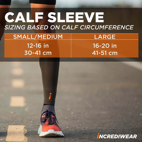 Person wearing a calf sleeve for pain relief and recovery, sizing chart displayed, breathable charcoal fabric for muscle fatigue and shin splints.