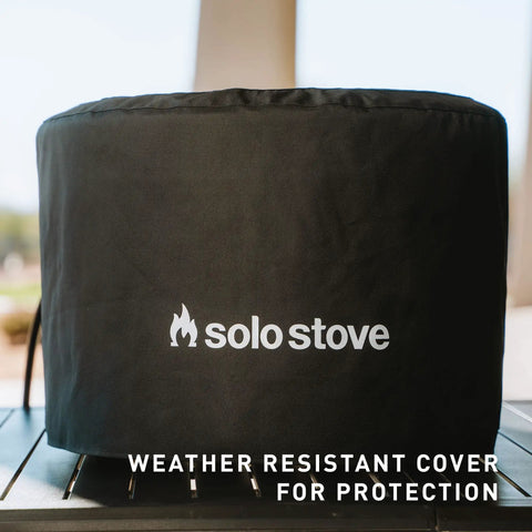 Pi Pizza Oven Shelter Protective Cover With Water Resistant PVC Lined Interior shown covering oven outdoors