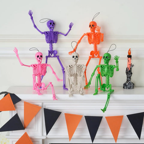 Spooky Hanging 16 Inch Posable Skeleton Set For Halloween Decor arranged on mantel, five colorful posable skeletons in festive pose.