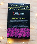 Box packaging of Battery Operated Fairy Lights Six Pack No Remote Waterproof Firefly String Lights On Silvery Copper Wire With Twenty LEDs Each Seven Feet Long For Wedding Patio Bedroom Christmas Decor Cool White with lights.