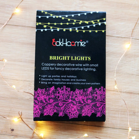 Box packaging of Battery Operated Fairy Lights Six Pack No Remote Waterproof Firefly String Lights On Silvery Copper Wire With Twenty LEDs Each Seven Feet Long For Wedding Patio Bedroom Christmas Decor Cool White with lights.