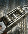 Close-up of 5-Pack Badass Sliding Window Roller Wheels with double wheel pulley and stainless steel frame.