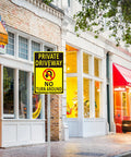 Front view of yellow and black aluminum No Turn Around driveway sign on a stake.