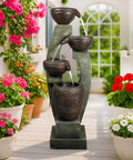 40 Inch Tall Outdoor Water Fountain With 4 Tier Crocks And LED Lights, Premium Resin And Fiberglass Construction in garden setting