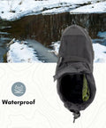 Badass Glacier Trekking Boots with Sweet Anti Slip Traction Spikes for Nasty Ice and Snow Waterproof Windproof 500 Denier Nylon Upper 32 Replaceable Cleats Keep Your Feet Safe from Slips on Gnarly Winter Surfaces Black Size 11 Includes Wrench, top view with snow background.