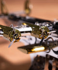 Close-up of propellers from Splashing Dreamer 3D Metal Airplane Model Kit With Wind-Up Moving Mechanism, Stainless Steel DIY Construction Set