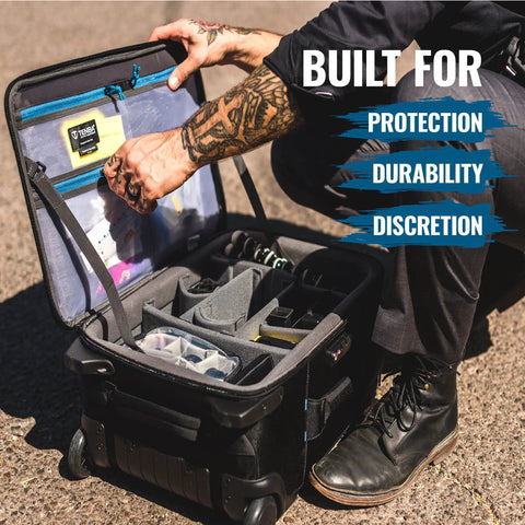 Person organizing gear in Carry-On Roadie Backpack 22 For DSLR And Mirrorless Cameras, Lenses, And 17-Inch Laptop Featuring Pro-Grade Travel Camera Bag