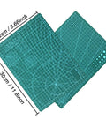 Cutting mats from the 44 Piece Gundam Model Tools Kit For Hobbyists, showing grid patterns and measurements.