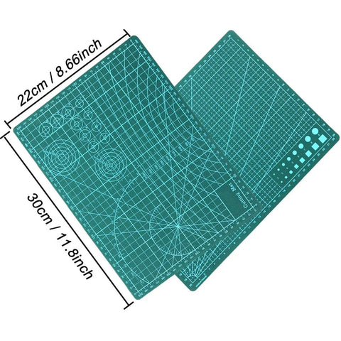 Cutting mats from the 44 Piece Gundam Model Tools Kit For Hobbyists, showing grid patterns and measurements.