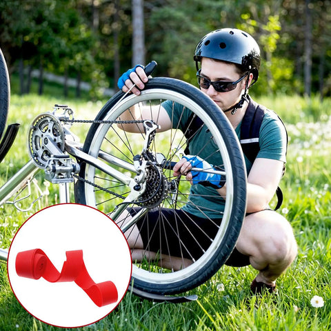 Cyclist repairing bike wheel with Two Pack 29 Inch Rim Tape For Road And Mountain Bikes, 13mm Wide, 0.5mm Thick, PVC Rim Strip Tape.