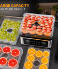 Pro Food Dehydrator With Slick One Touch Presets And Five Stackable Trays For Hassle Free Jerky Fruit Herbs And Dog Treats Straight Up Digital Timer Controls Inside A Compact Bpa Free Build That Knocks Out Silky Jerky On Repeat showing dried strawberries, oranges, kiwis, and grapefruits on clear trays, with digital display.