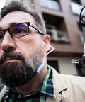 Close-up of man wearing Hella Reliable Wireless Bluetooth Lapel Microphone With Integrated Push To Talk For Radios Phones And Tablets.