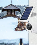 Wyze Cam Outdoor Solar Panel 3 Pack White, 2W 5V on snow-covered wall with camera mount in winter