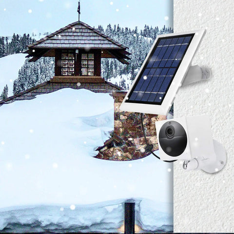 Wyze Cam Outdoor Solar Panel 3 Pack White, 2W 5V on snow-covered wall with camera mount in winter