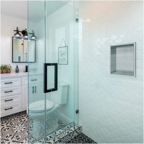 Bathroom with 12 By 12 Inch Shower Niche In Brushed Nickel Stainless Steel, built into a tiled shower wall with glass door.