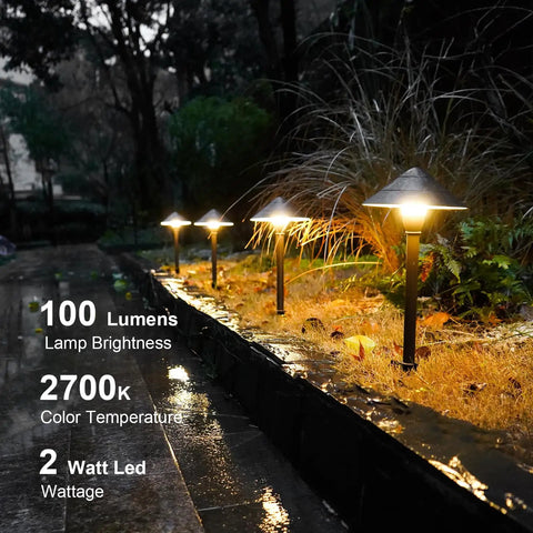 4 Pack Low Voltage Path Lights Kit With 2W LEDs 100 Lumen Warm White 2700K Bronze Outdoor Walkway Lighting Easy Install Cable Connectors Included For A Cozy Welcoming Landscape Accent illuminating a wet garden path