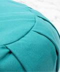 Zafu Yoga Meditation Cushion With Washable Cover And Buckwheat Filling Soft Round Cotton Floor Pillow For Meditation Pranayama And Stress Relief Turquoise Color Cozy Ergonomic Vibe For Home Studio Or Yoga Room close-up of stitched cotton cover