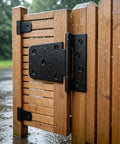 Top Shelf 3.5 Inch Gate Hinges 2 Pack, Straight Up Black Iron T Door Hardware on a wooden gate in rain.