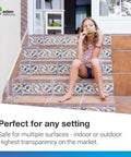Child sitting on tiled stairs without the Clear Non Slip Carpet Stair Treads For Wooden Steps 15 Pack 30 By 8 Inches Peel And Stick Slip Resistant Mats Indoor Outdoor Safe Traction For Stairs And Runners.